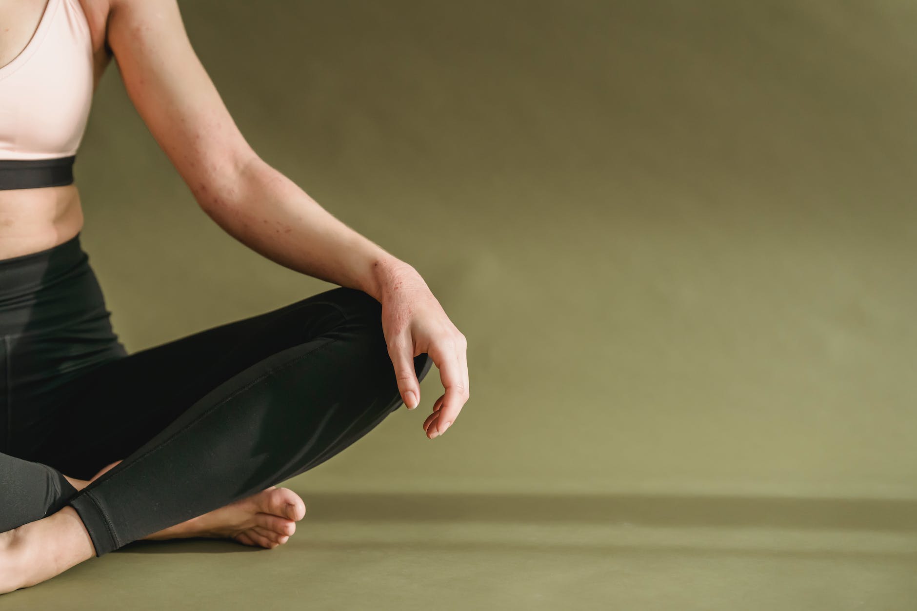 young woman doing yoga in lotus pose